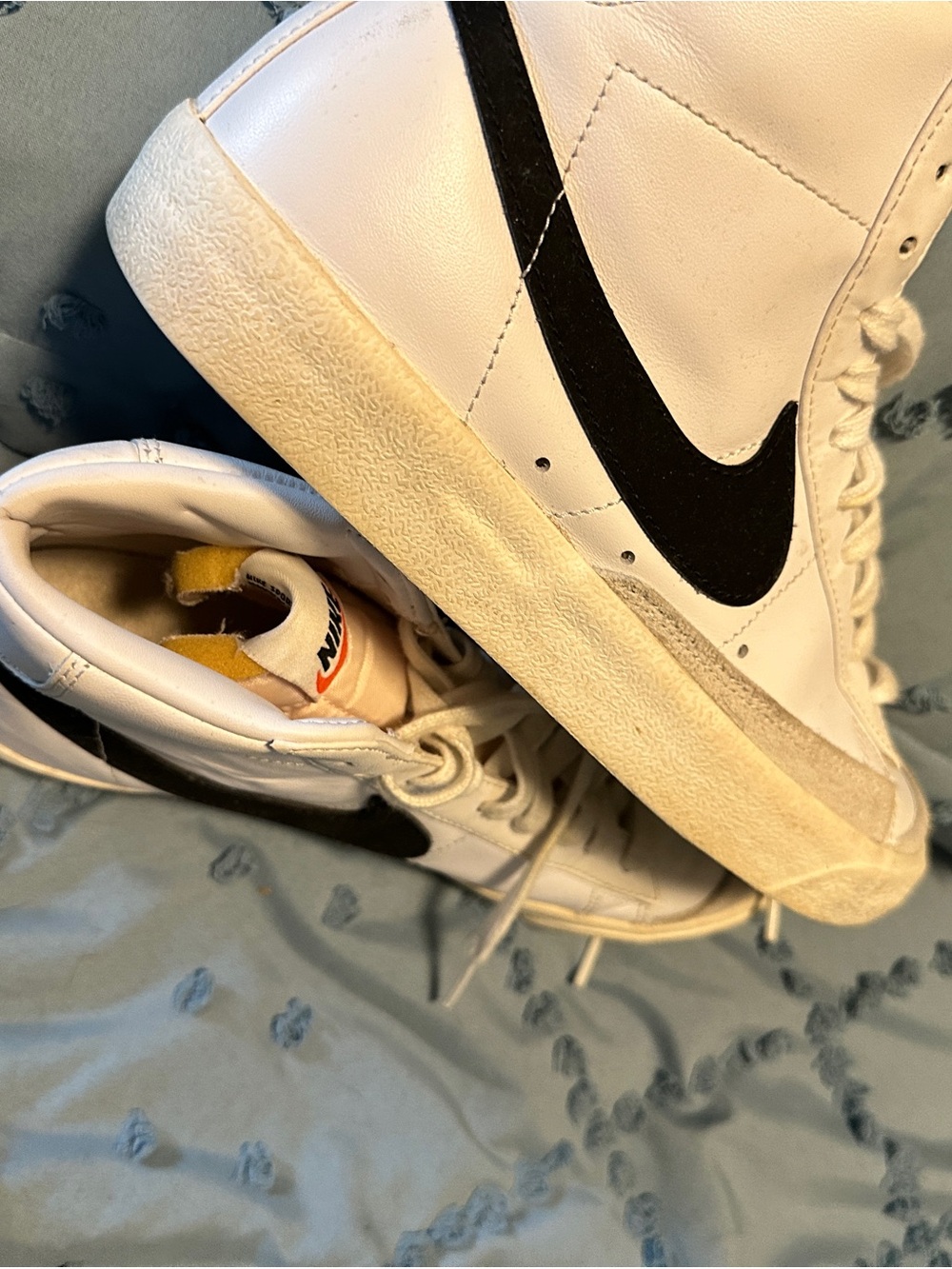 Nike White High-Top Sneakers with Black Swoosh